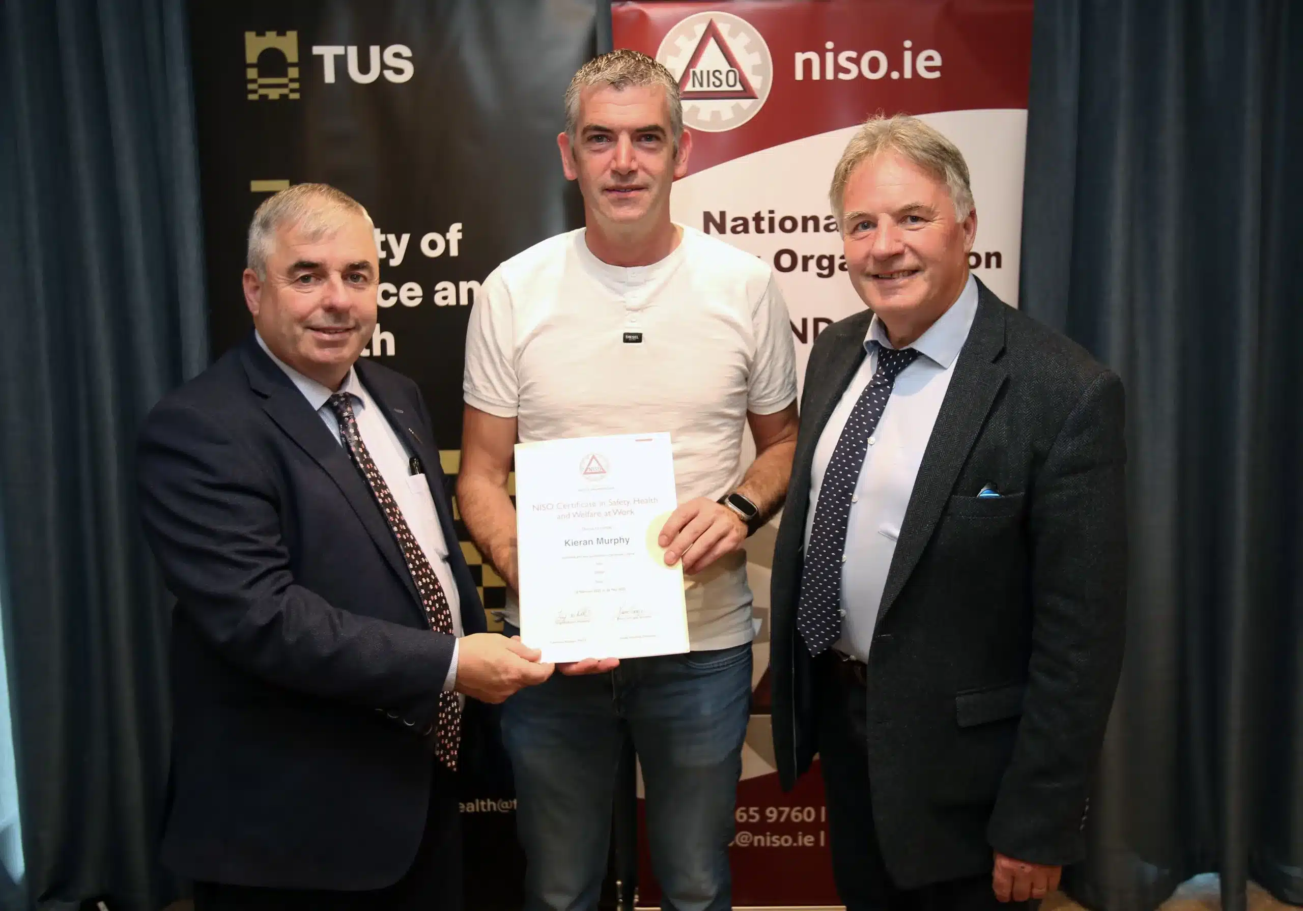 Kieran Murphy Achieves NISO Certificate in Safety, Health and Welfare at Work. Receiving certificate in image